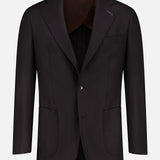 The ATELIER MUNRO Wide Notch Lapel Solid Suit is a dark brown wool-blend blazer with notch lapels, chest pocket, two patch pockets, and two buttons, shown front-facing on a plain white background.