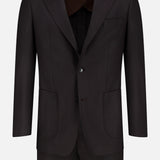 The Wide Notch Lapel Solid Suit by ATELIER MUNRO is a black wool blend two-piece men’s suit with notch lapels, two front buttons, patch pockets, and a chest pocket, shown on a white background.