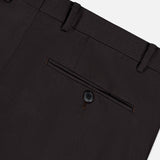 Close-up of the back pocket on the Wide Notch Lapel Solid Suit by ATELIER MUNRO, showing a single button closure and belt loops in dark brown wool blend fabric against a light gray background.