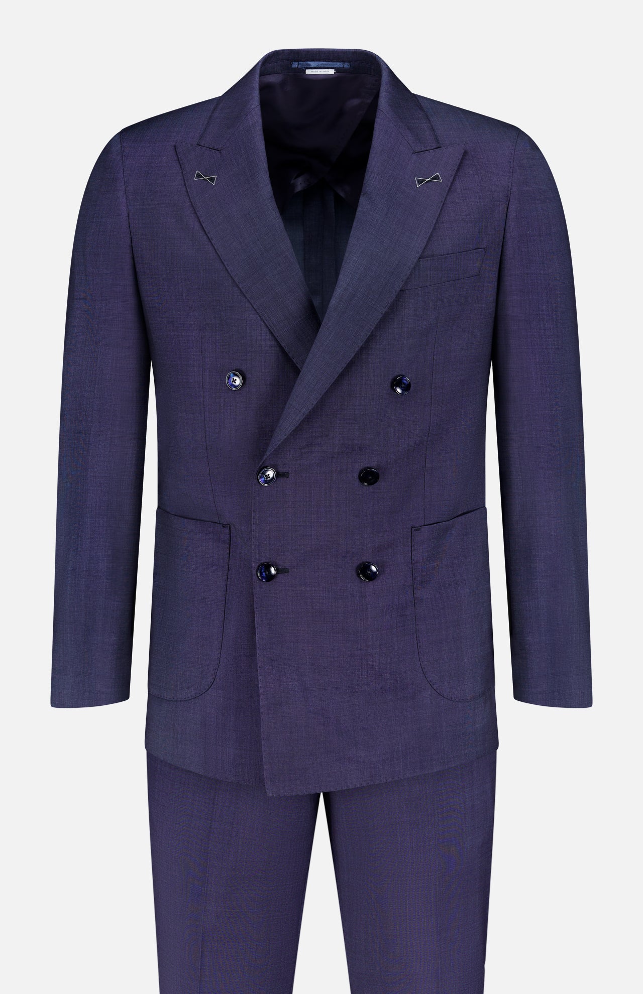 The ATELIER MUNRO Wool Silk Fancy Weave Double Breasted Suit features a dark purple hue, peak lapels, four buttons per side, flap pockets, and matching trousers, perfect for formal events—shown on a plain white background.