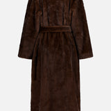 Back view of The Mink Coat by Auter, a full-length dark brown animal-free mink coat with a tie waist.