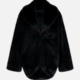 Auter The Mink Cocoon Coat is a black animal-free faux fur coat with an oversized fit, featuring a wide collar and a curved, cropped hem.
