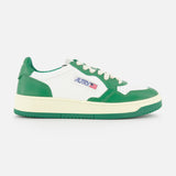 The AUTRY Medalist Low Bicolor Sneakers feature a green and white low-top design, cream platform sole, white laces, and a small AUTRY logo with an American flag on the side.