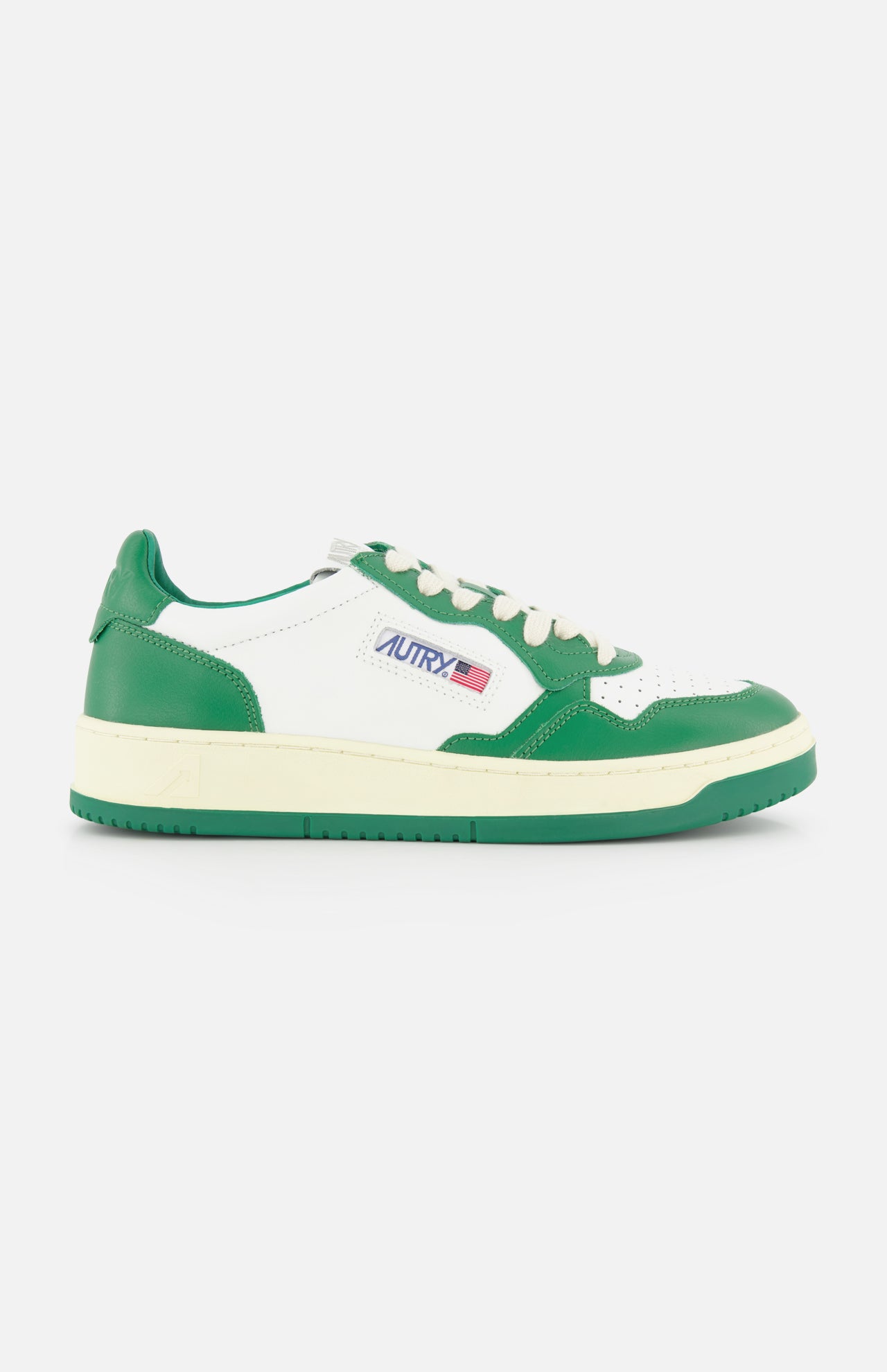 The AUTRY Medalist Low Bicolor Sneakers feature a green and white low-top design, cream platform sole, white laces, and a small AUTRY logo with an American flag on the side.