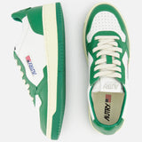 The AUTRY Medalist Low Bicolor Sneakers feature green and white panels, cream laces, the signature AUTRY logo, and an American flag patch on the side—perfect as stylish white tennis shoes. One shoe is shown from the side, the other from above.