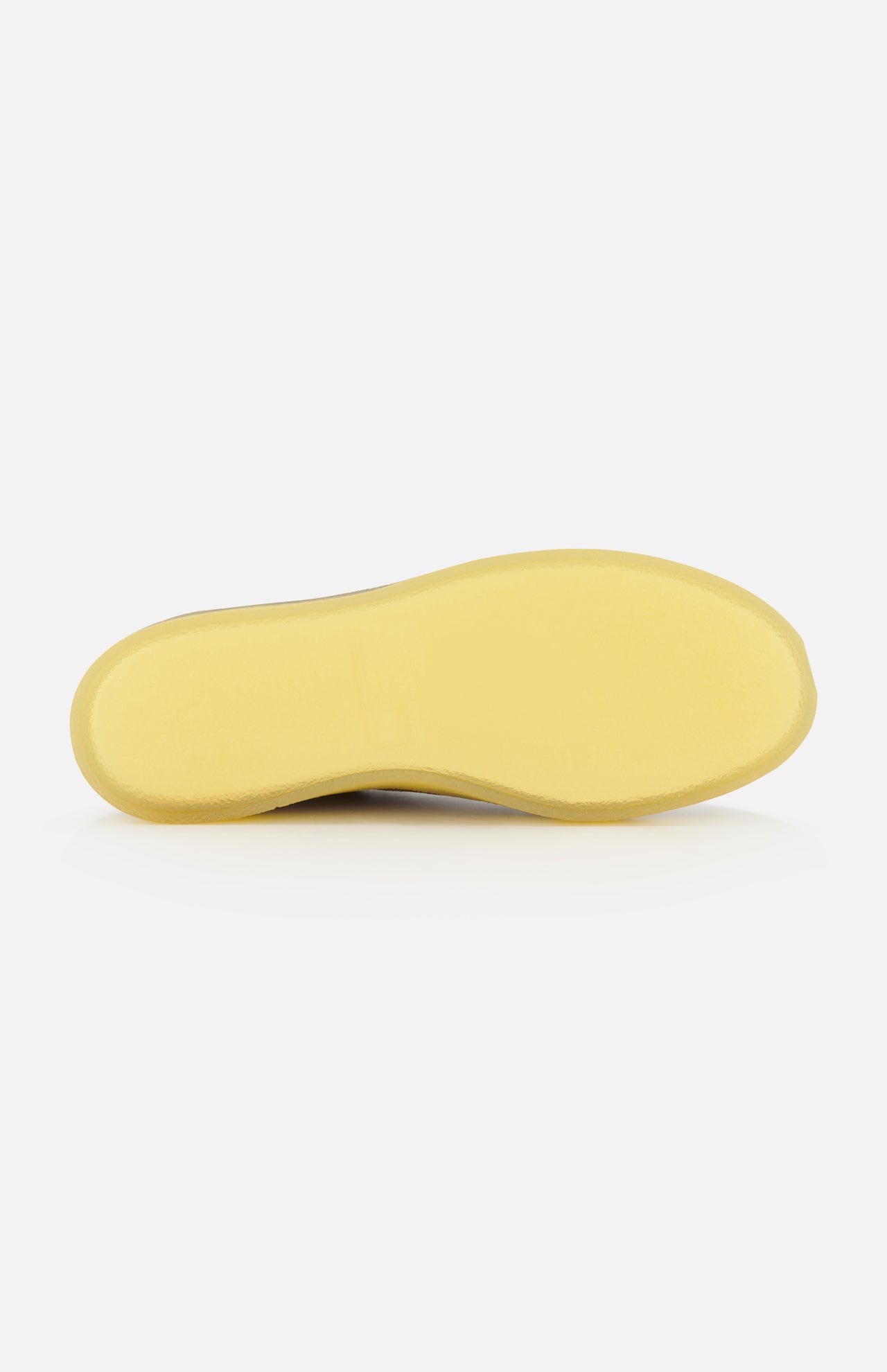 The image shows the bottom view of the AUTRY Medalist Low Man Suede Leather Sneaker, featuring a plain, light yellow sole against a white background.