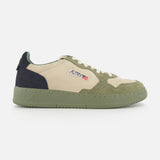 The AUTRY Medalist Low Man Suede Sneaker features a beige and green low-top design crafted from multicolored suede, highlighted by a green platform sole, a dark green heel, and the signature AUTRY logo with a small American flag on the side for a distinctive look.