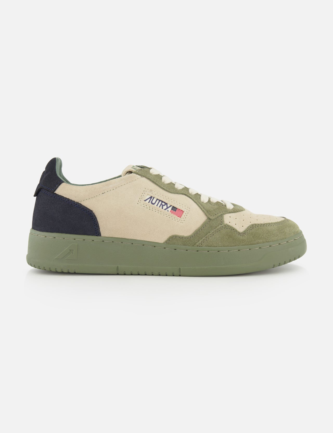 The AUTRY Medalist Low Man Suede Sneaker features a beige and green low-top design crafted from multicolored suede, highlighted by a green platform sole, a dark green heel, and the signature AUTRY logo with a small American flag on the side for a distinctive look.