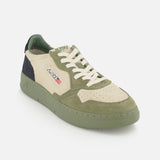 The AUTRY Medalist Low Man Suede Sneaker is a low-top silhouette in green and beige, crafted with multicolored suede and mesh panels, white laces, and a green sole. This style is finished with the signature Autry logo and a small USA flag on the side for an iconic touch.