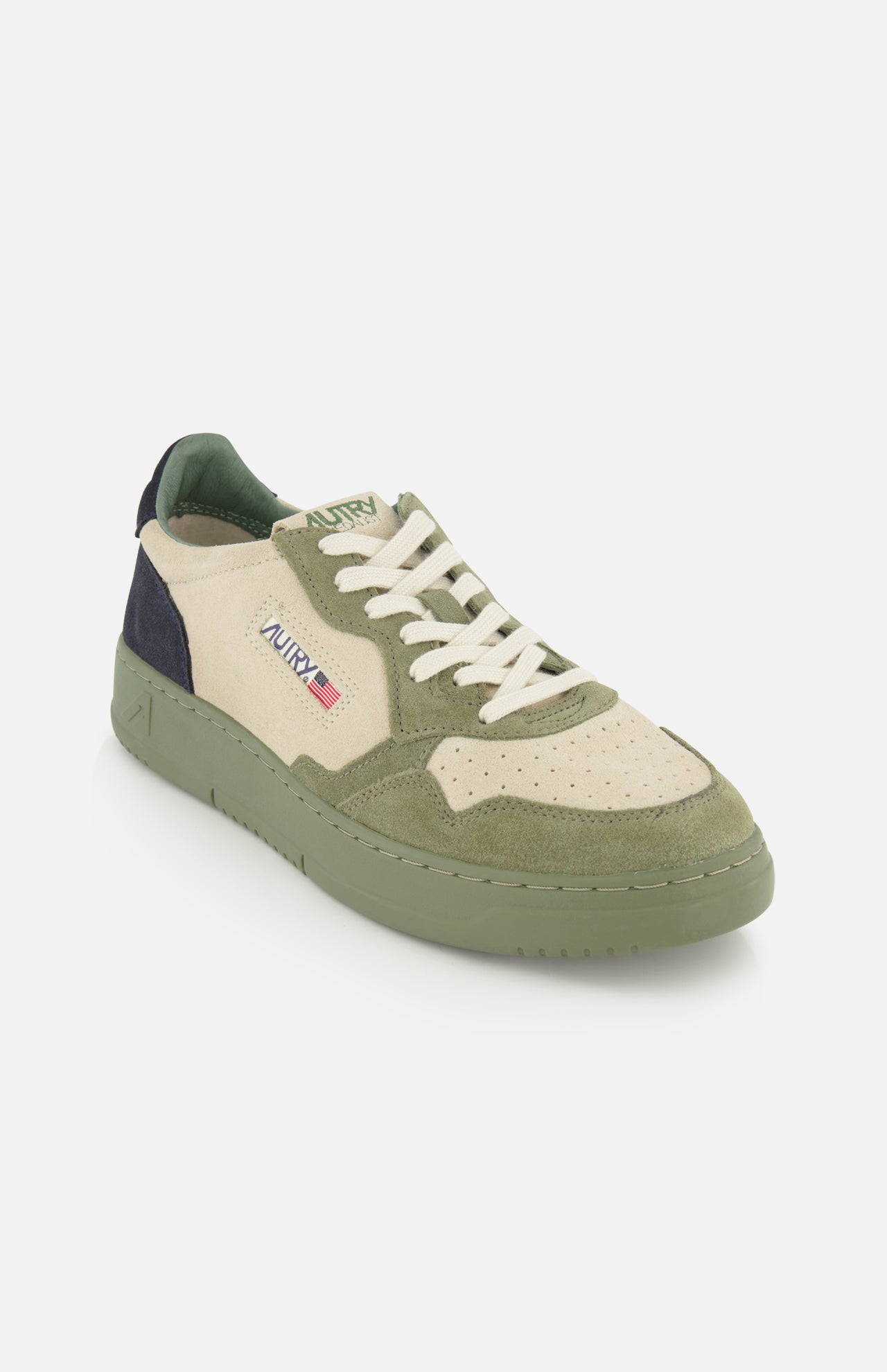 The AUTRY Medalist Low Man Suede Sneaker is a low-top silhouette in green and beige, crafted with multicolored suede and mesh panels, white laces, and a green sole. This style is finished with the signature Autry logo and a small USA flag on the side for an iconic touch.
