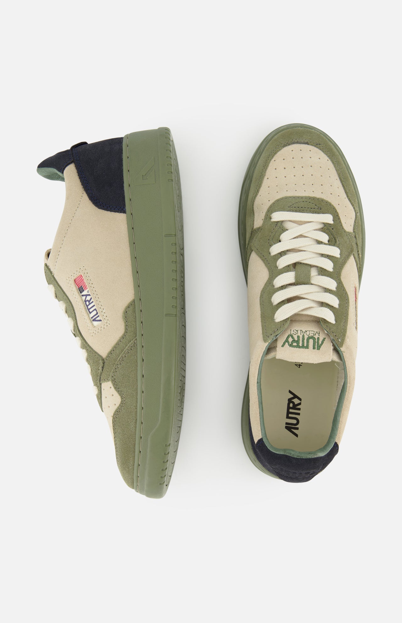 AUTRY’s Medalist Low Man Suede Sneakers in beige and olive green are displayed from the side and top, highlighting their multicolored suede and leather panel design, white laces, perforated toe box, and distinctive green rubber sole.