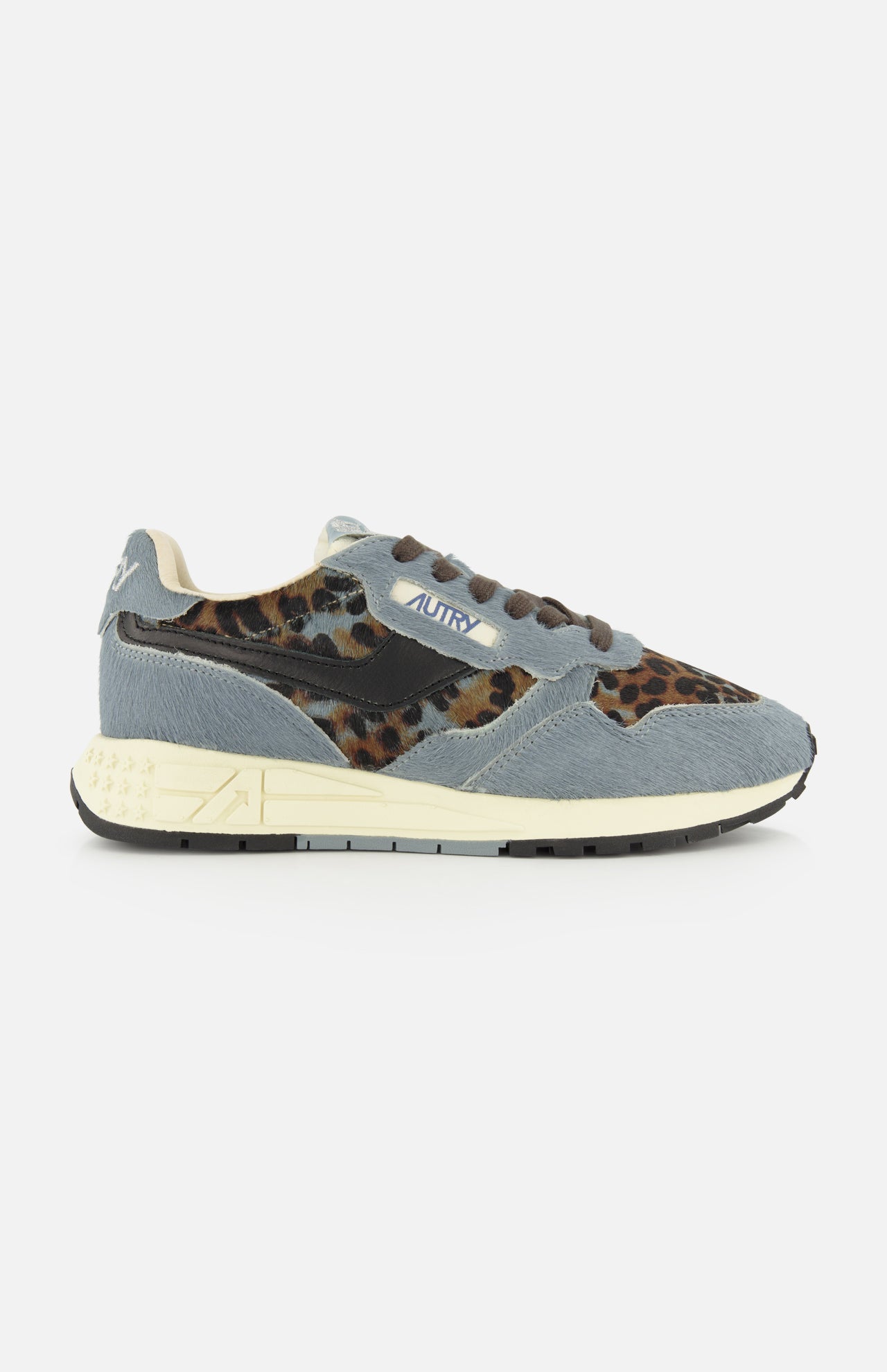Sure! Here’s a rewritten version using your product data: The AUTRY Reelwind Low Pony Hair Sneaker, featuring gray and leopard-print pony hair uppers, a white sole, brown and black laces, and a blue “Autry” label on the side, is thoughtfully designed for an active lifestyle. Shown against a white background.
