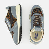 The AUTRY Reelwind Low Pony Hair Sneaker features striking blue-gray uppers with black accents, tan soles, and bold brown leopard print details. Displayed from the side and top against a white background, these stylish low-top sneakers deliver the ideal combination of standout design and comfort for an active lifestyle.