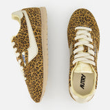 The AUTRY Windspin Leopard Low Sneaker features a 60s-inspired leopard print, white accents, and beige soles, shown from side and top views against a white background.