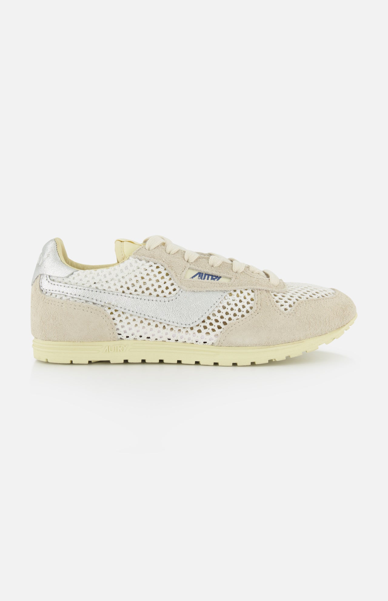 The AUTRY Windspin Low Knit Sneaker features beige mesh, suede overlays, a cream sole, a subtle white swoosh on the side, and a small blue AW logo near the laces for classic vintage style.