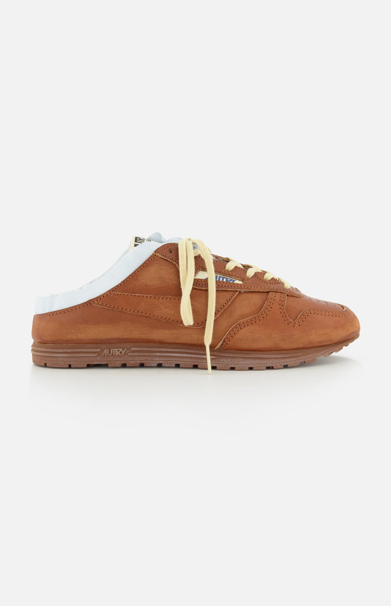 The AUTRY Windspin Leather Mule Sneaker features brown leather, a white sole, yellow laces, vintage charm, and an open back—displayed on a white background.