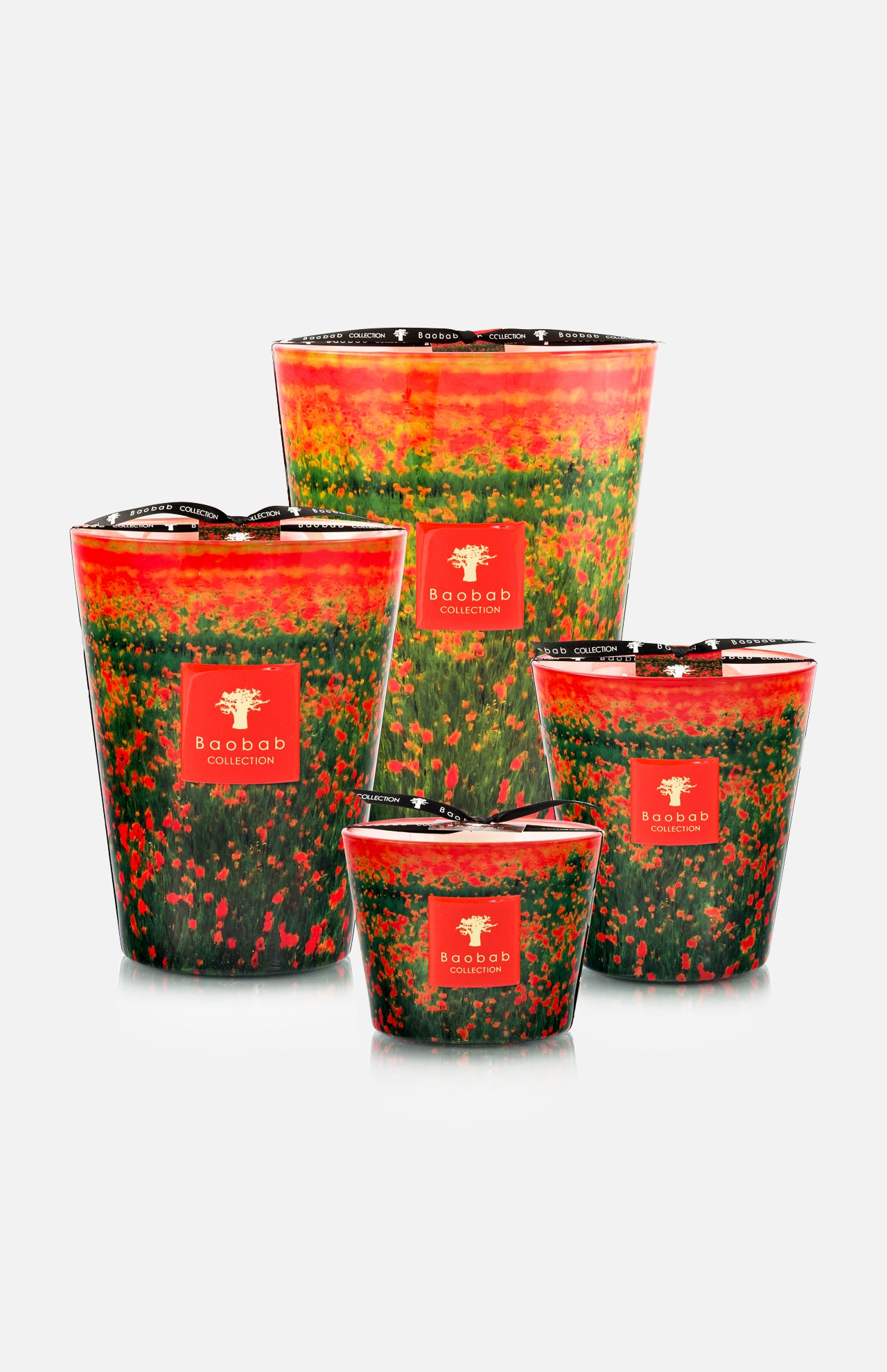 The BAOBAB COLLECTION Arty Flowers Poppies Max 24 Candle, hand-poured with vibrant red, orange, green, and black patterns, fills your space with a refreshing bergamot scent. Perfect as a colorful accent on any white backdrop.