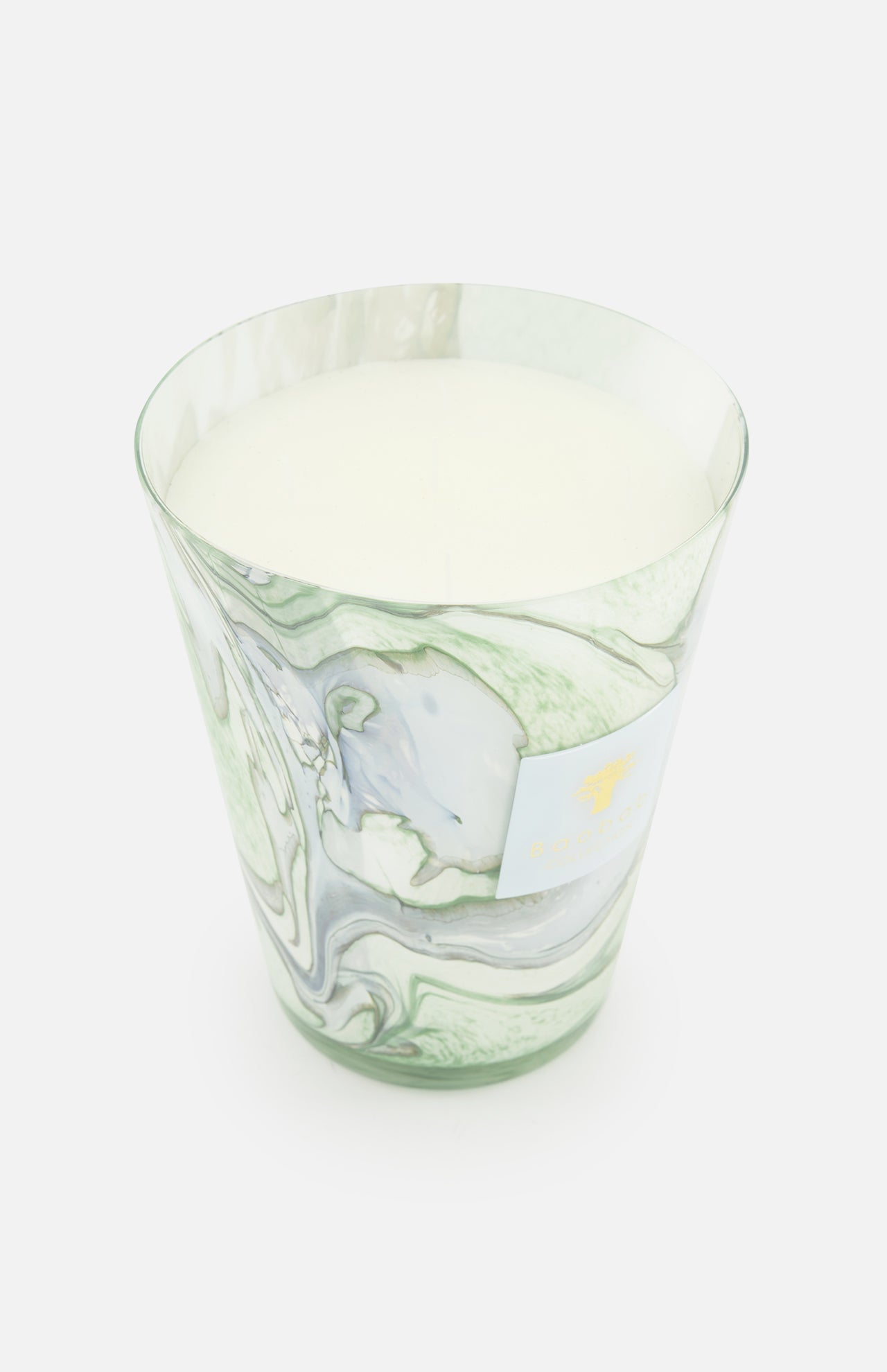 The Leaves Marius Max 24 Candle by BAOBAB COLLECTION is a large, white scented candle in a marbled glass holder with green and gray swirls, hand-poured wax inside, and a small gold-embossed label on the front against a plain white background.