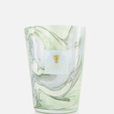 The Leaves Marius Max 24 Candle by BAOBAB COLLECTION features hand-poured wax in a marbled glass container with swirling green, grey, and white patterns and a white and gold brand label on the front.