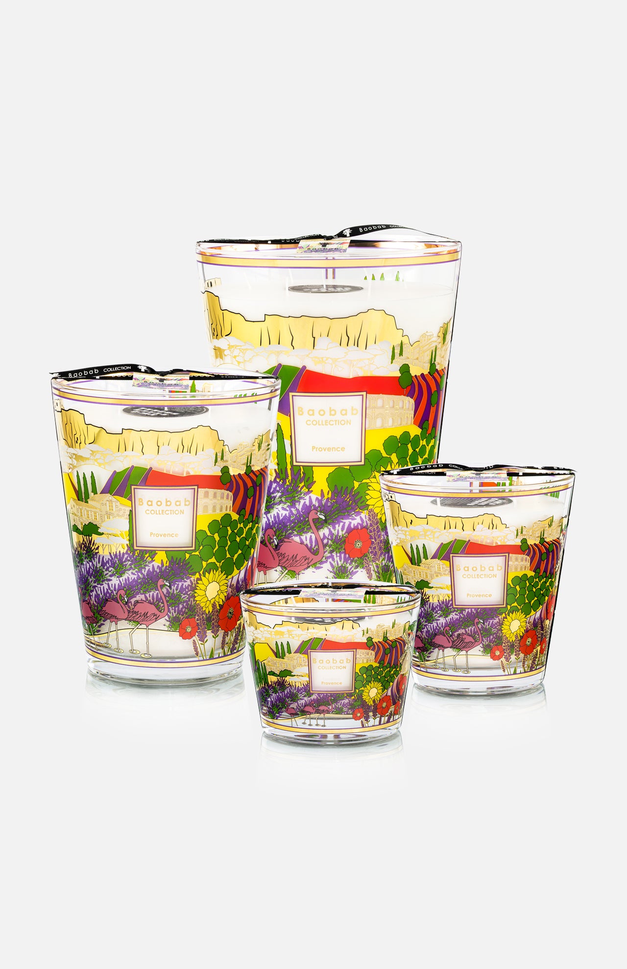 Four hand-poured glass candles of varying sizes with colorful floral and landscape designs inspired by David Hockney. Each aromatic candle features a SABBA COCODREAM Pineapple label. Product: Provence Max 16 Candle by BAOBAB COLLECTION.