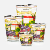 Four Provence Max 24 candles by BAOBAB COLLECTION, each with colorful floral-themed labels and hand-poured wax, are grouped on a white background. These luxurious Sabbath Day candles are both decorative and aromatic.