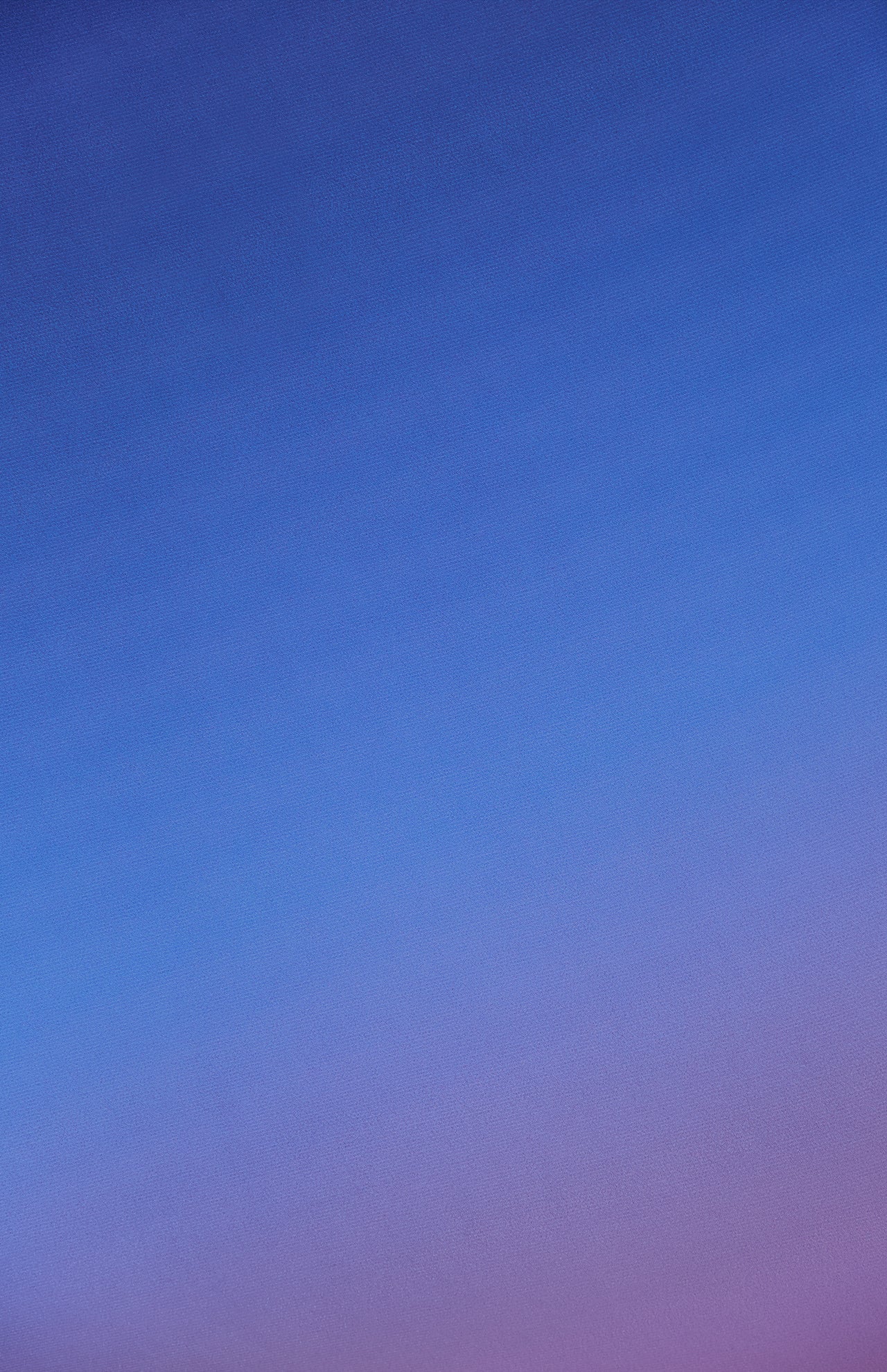 The BAOBAB Blake Gradient Maxi Dress features a smooth gradient design that transitions from deep blue at the top to soft purple at the bottom.