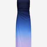 Blake Gradient Maxi Dress by BAOBAB, a halter-neck style with side ruching, showcases a striking gradient design that transitions from dark navy at the top to light lavender at the bottom, set against a plain white background.