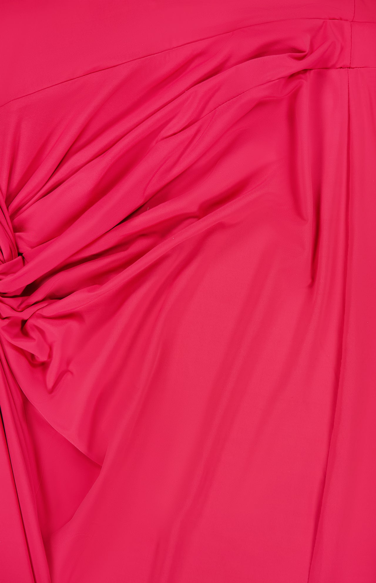 A close-up of bright pink, gathered and ruched fabric highlights the dynamic texture of BAOBAB's Canoa Knot Detail Maxi Dress in dark pink.