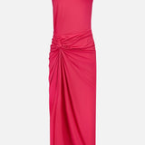 The BAOBAB Canoa Knot Detail Maxi Dress is a vibrant dark pink one-shoulder gown featuring a decorative shoulder pin and a ruched knot at the waist, with draped folds cascading down its long, fitted skirt.