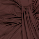 Close-up of the Donatella Cascading Detail Maxi Dress by BAOBAB, featuring chocolate brown fabric with gathered pleats and central ruched detailing for a textured look.