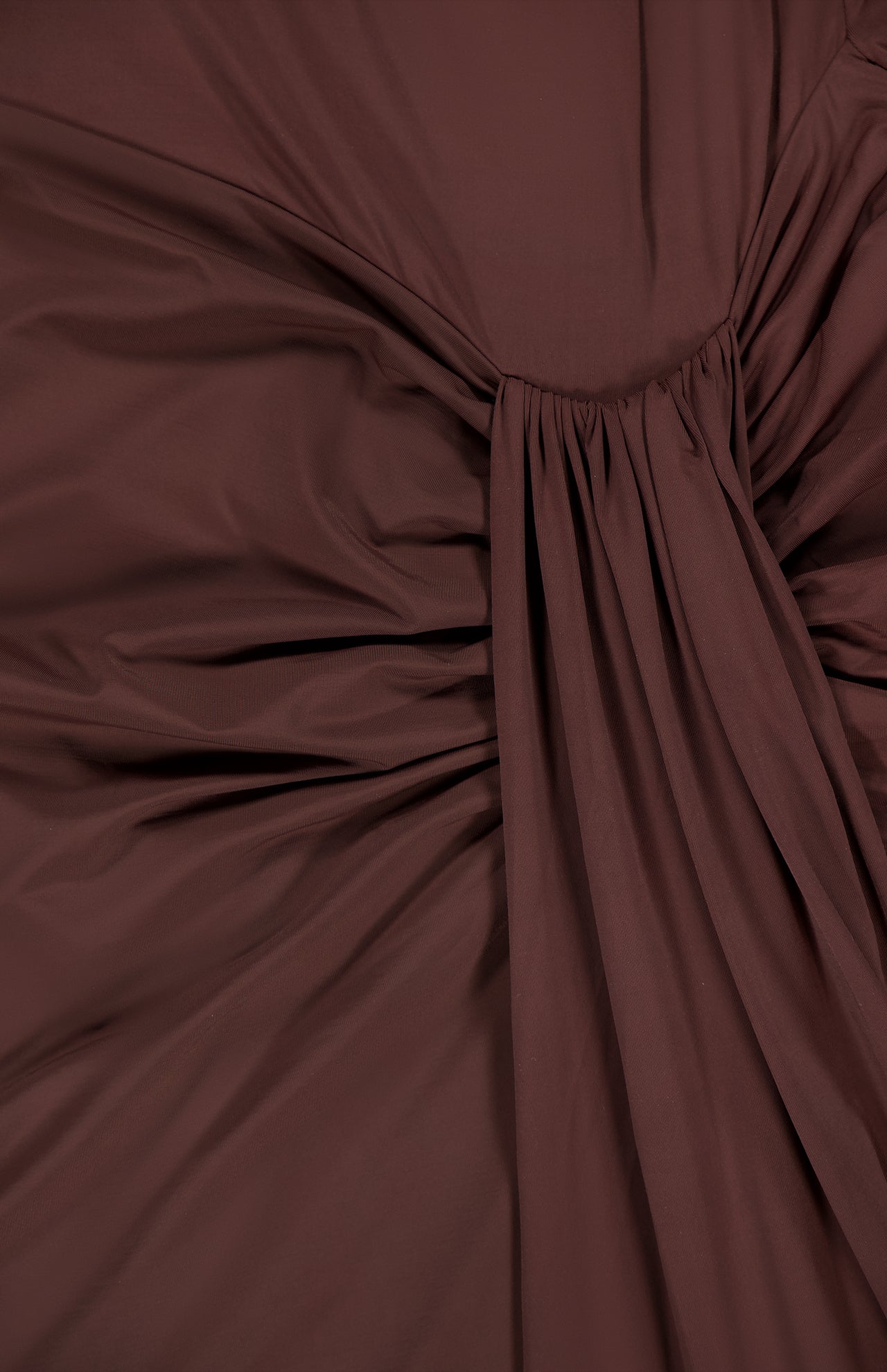 Close-up of the Donatella Cascading Detail Maxi Dress by BAOBAB, featuring chocolate brown fabric with gathered pleats and central ruched detailing for a textured look.