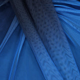 Close-up of layered blue mesh fabric in varying shades and textures from the Lena Strapless Maxi Dress by BAOBAB, featuring draped folds that create cascading details and a wavy, patterned look.