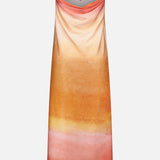 The Lola Open Back Maxi Dress by BAOBAB is a strapless tangerine maxi with an ombré gradient in orange, yellow, and pink. It features a draped neckline with a beaded string accent and an elegant open back for added allure.