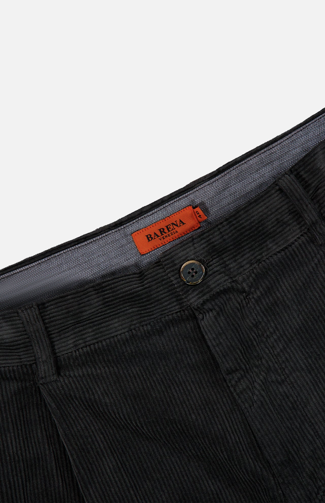Close-up of the Cortivo Corduroy Pants by BARENA, featuring dark grey corduroy fabric, a button closure, and an orange BARENA label on the waistband, expertly crafted in Italy.