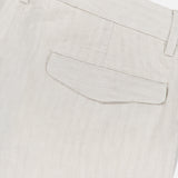 Close-up of the back pocket on BARENA’s Delfo Lisca Herringbone Pants in light beige, featuring a buttoned flap, belt loops, and finely stitched herringbone weave fabric.