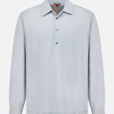 The Desmo Button Up Long Sleeve Shirt by BARENA is a light blue cotton shirt featuring a collar and three buttons down the front. Made in Italy, it has a plain design with no visible patterns or logos and is shown against a white background.