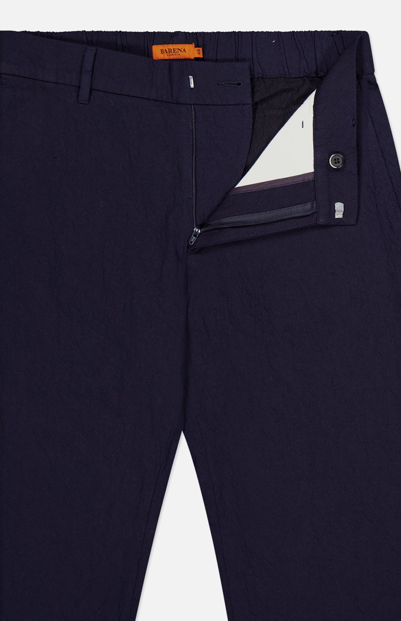 Dosana Dandaro Pants by BARENA, made in Italy in dark navy, shown with the waistband, zip, and button fly partially open to display a white lining and an orange label inside the waistband.