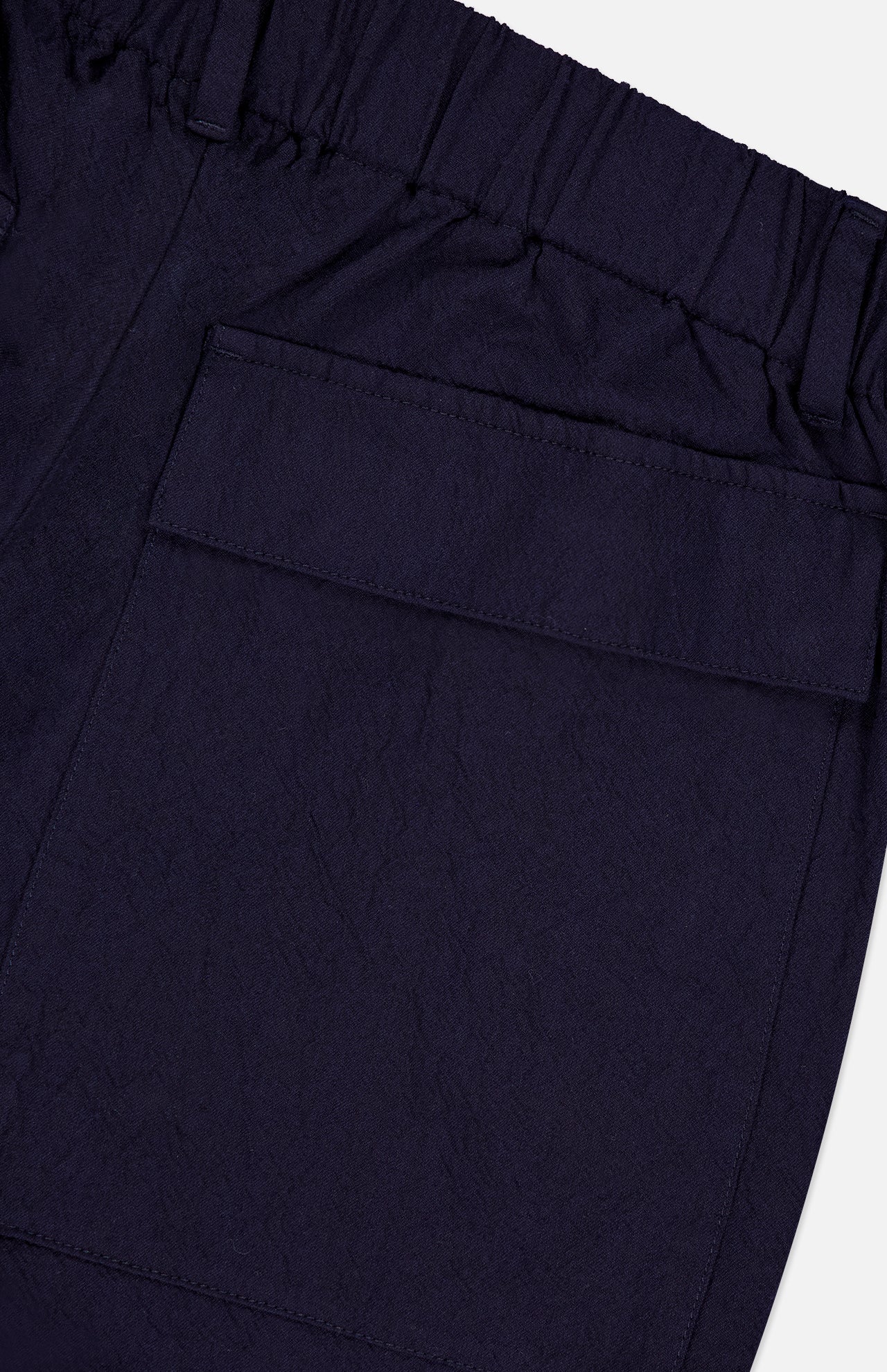 Close-up of BARENA Dosana Dandaro Pants in navy, made in Italy with slightly textured fabric. Features include an elastic waistband and a large side flap pocket, reflecting the brand's quality craftsmanship.