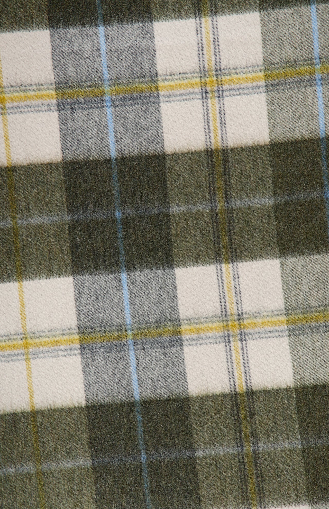 A close-up of the Arran Bennet Plaid Scarf by BEGG & CO showcases its dark green, white, and yellow intersecting lines and squares—an iconic plaid pattern crafted in cashmere for a classic Scottish accessory.