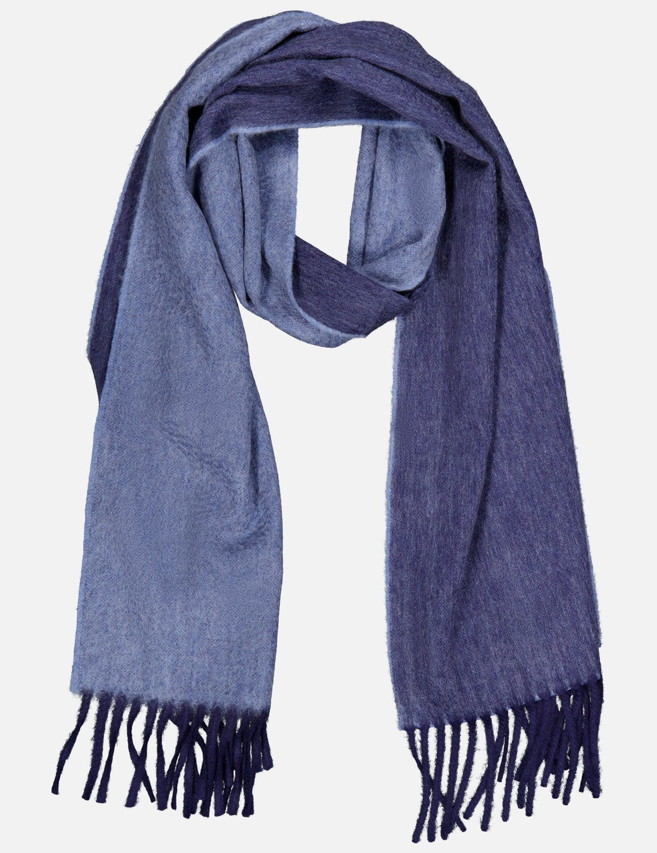 The Arran Reversible Scarf by BEGG & CO is a luxurious cashmere accessory made in Scotland, showcasing two-toned blue hues with light blue on one side and dark blue on the other. Finished with fringe at both ends, the scarf is elegantly displayed laid flat on a white background.