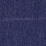 Close-up of blue denim fabric, its textured weave and subtle color variations echoing the timeless craftsmanship of the Arran Reversible Scarf by BEGG & CO, expertly made in Scotland.