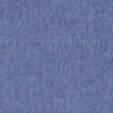 A close-up of the Arran Reversible Scarf by BEGG & CO reveals a blue felt texture, echoing the luxurious quality of Scottish craftsmanship, with a soft, fuzzy surface featuring subtle color variations and delicate fibers throughout.