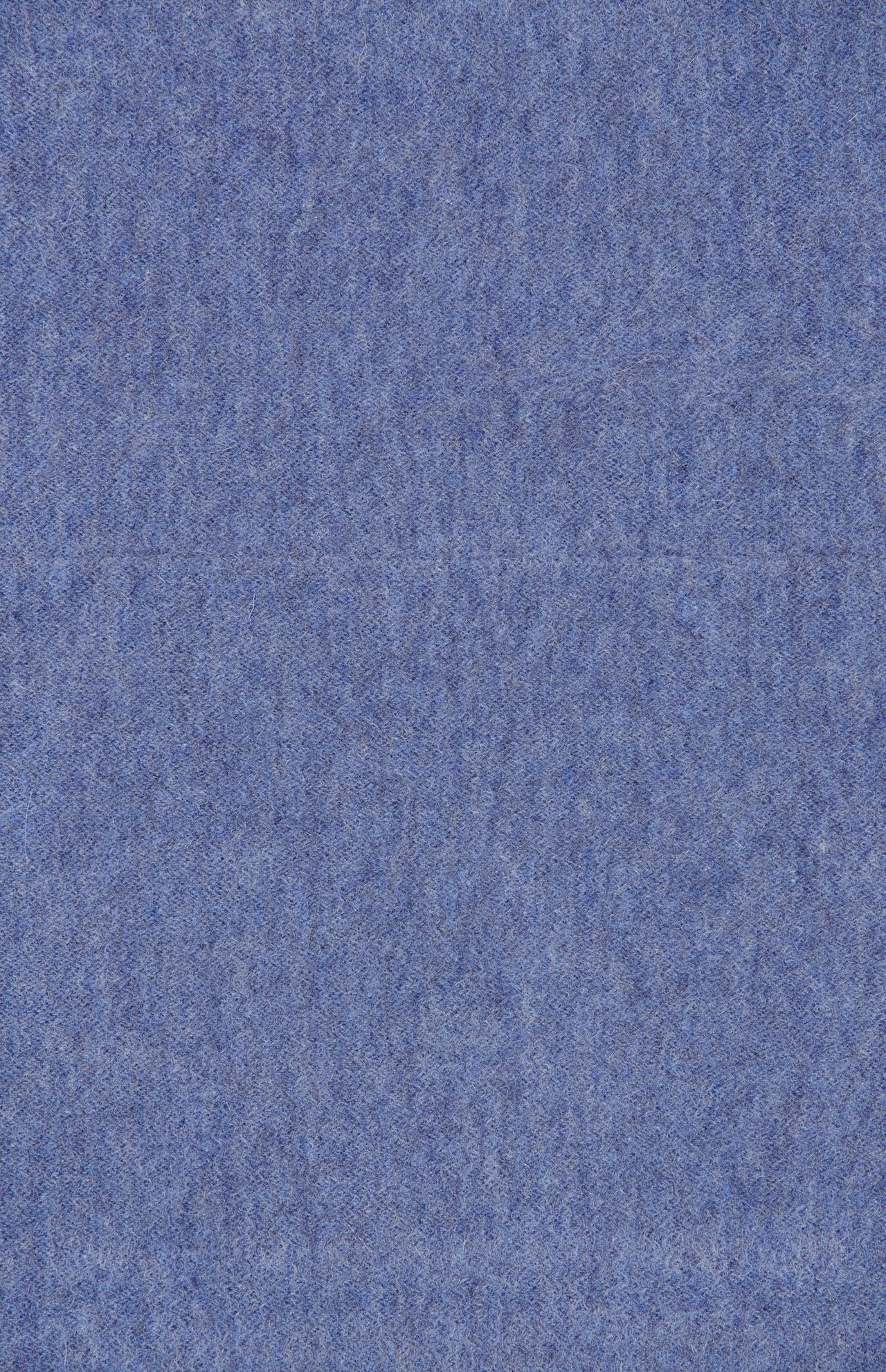 A close-up of the Arran Reversible Scarf by BEGG & CO reveals a blue felt texture, echoing the luxurious quality of Scottish craftsmanship, with a soft, fuzzy surface featuring subtle color variations and delicate fibers throughout.