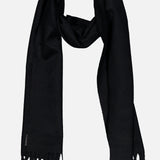 The BEGG & CO Arran Solid Scarf, a luxurious black cashmere accessory with fringed ends, made in Scotland, is laid flat on a white background.