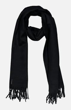 The BEGG & CO Arran Solid Scarf, a luxurious black cashmere accessory with fringed ends, made in Scotland, is laid flat on a white background.