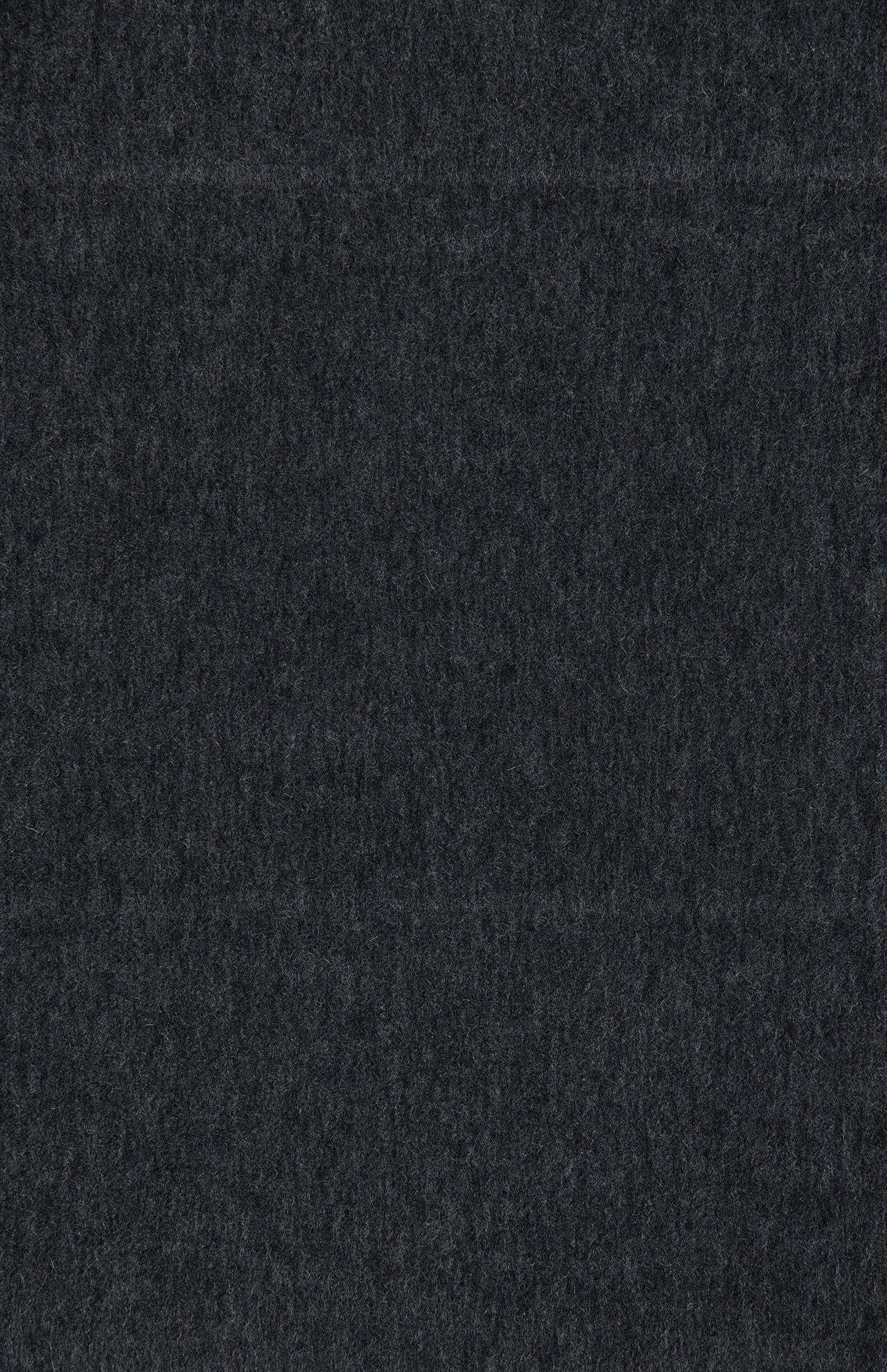 A close-up of a dark, textured fabric surface, featuring subtle horizontal lines and a soft, even appearance throughout—evoking the luxurious quality of the BEGG & CO Arran Solid Scarf in an elegant dark grey shade.