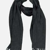 BEGG & CO Arran Solid Scarf in dark grey cashmere, crafted in Scotland with soft fabric and finished with fringed ends. Displayed flat on a light background, the scarf is loosely folded to highlight its luxurious texture and generous length.