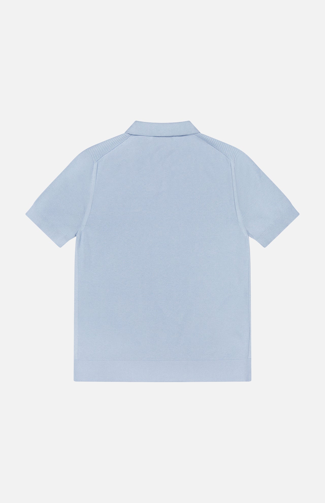 The BELSTAFF Coast Knitted Waffle Polo Shirt in light blue cotton-silk is laid flat, shown from the back against a white background, highlighting its ribbed collar, cuffs, hem, and Johnny collar detail.