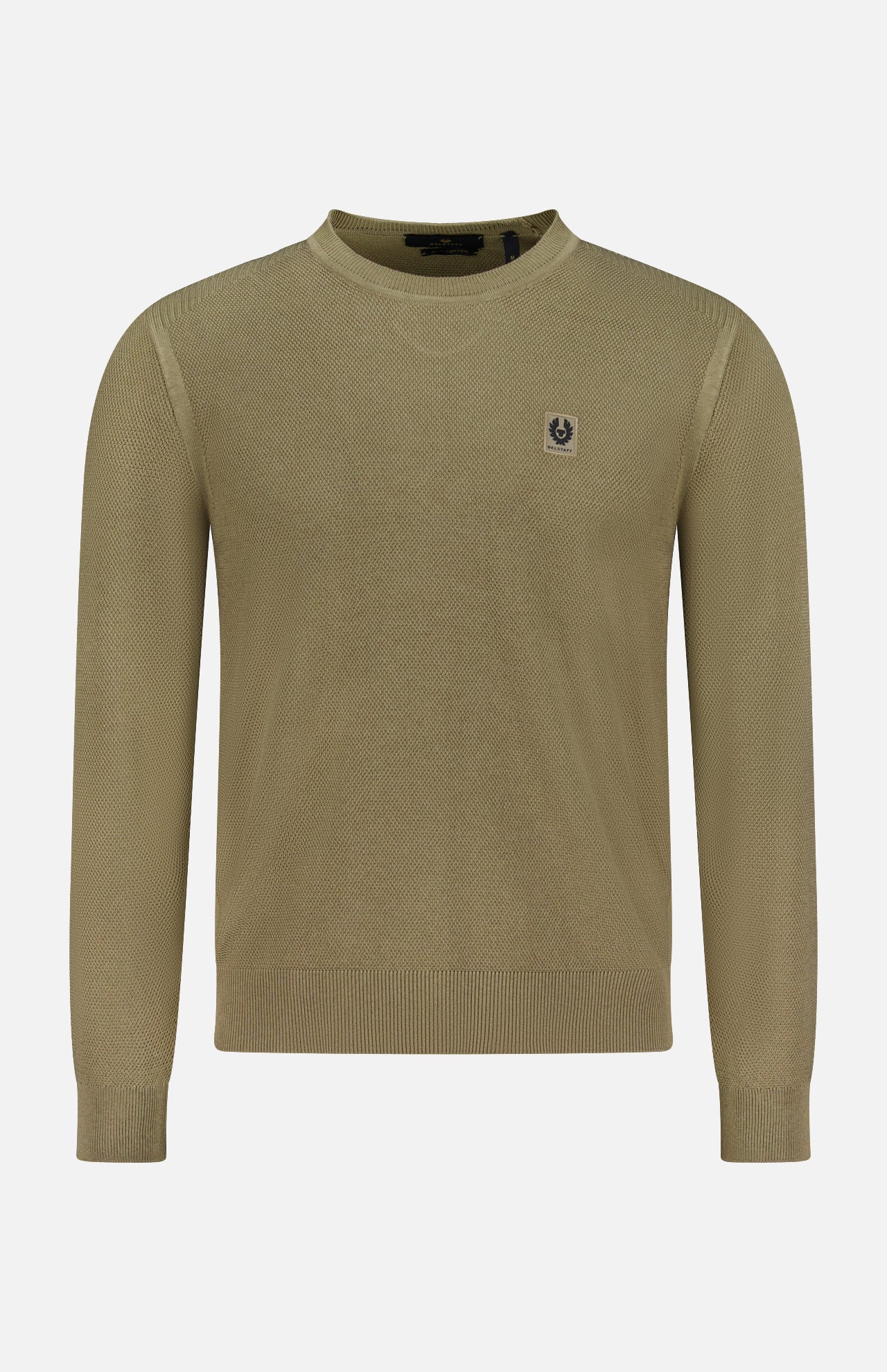 The BELSTAFF Coast Knitted Sweater is a light olive green, long-sleeve top with a lightweight waffle texture, crew neck, ribbed cuffs and hem, and a small embroidered crest logo on the left chest. Shown on a plain white background.