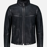 Channeling classic British heritage, the BELSTAFF Highland Shearling Jacket features a high collar and zipper closure, complemented by two zippered side pockets and a soft, textured finish. With its slightly rugged, matte appearance, visible stitching, and fleece-lined interior reminiscent of an English shearling jacket, it’s the perfect blend of timeless style and modern comfort.